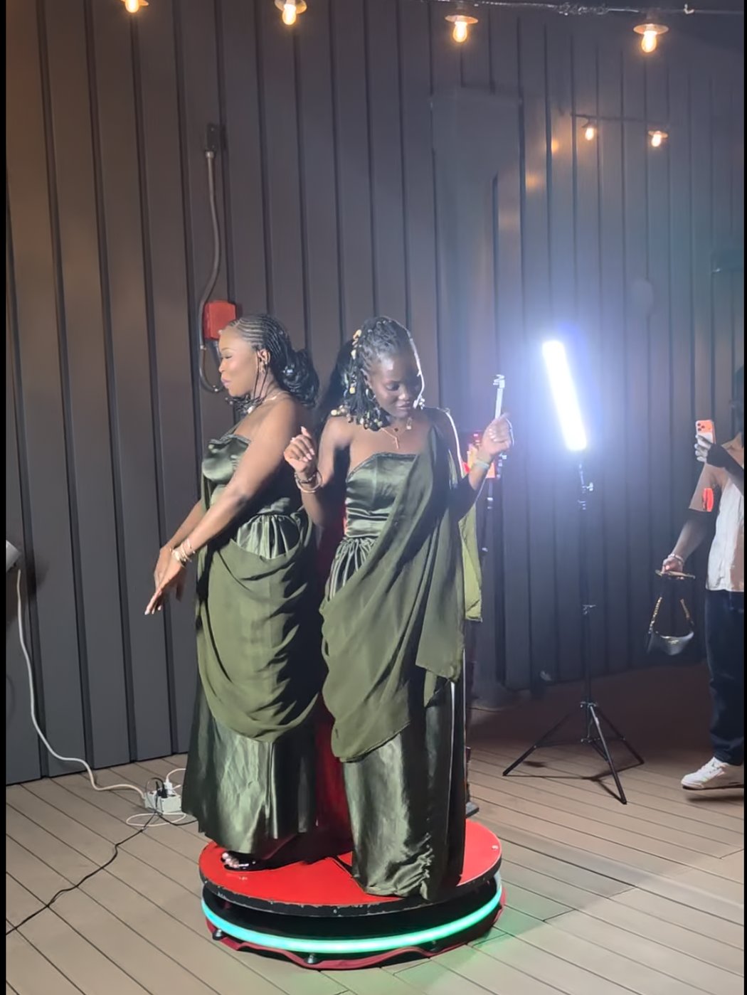 Guests on a 360 Video Booth platform recording a spin video